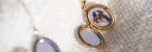 Close-up of a photo in a gold oval locket.