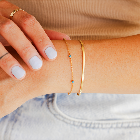 Stacked bracelets from Made By Mary styled together on the wrist.