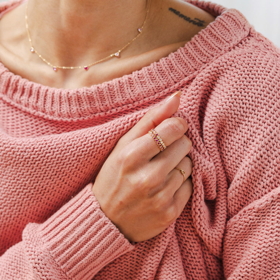 A model wearing Made By Mary Valentine's Day jewelry.