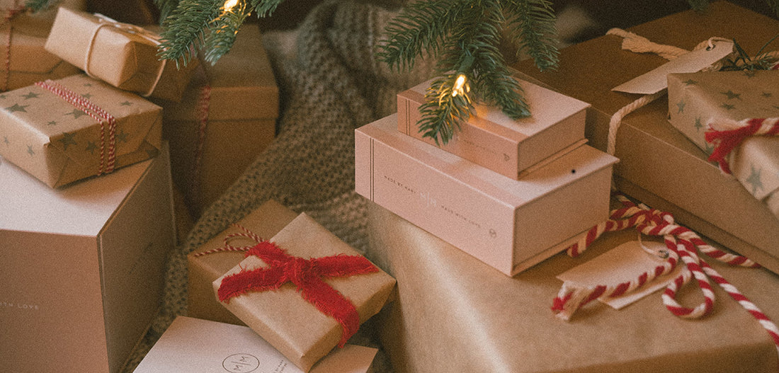 Wrapped presents beneath a Christmas Tree.