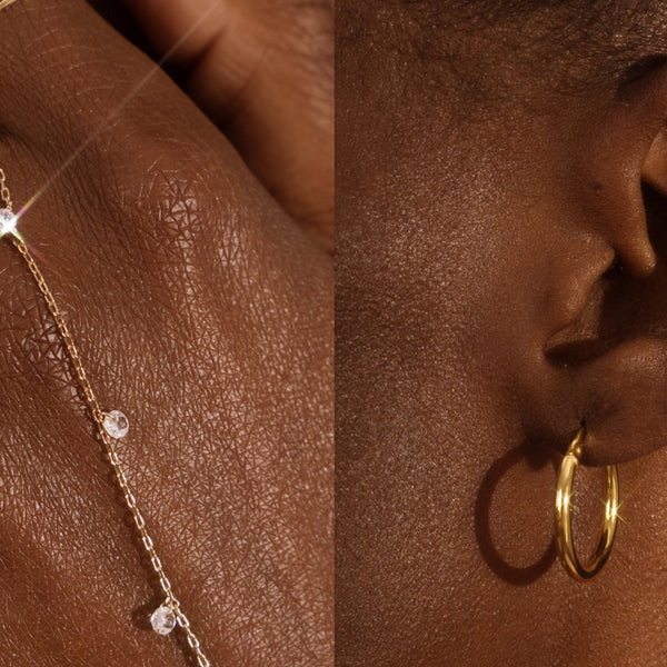 A split image with one side being a person's hand wearing a gold hand chain with small clear crystals dangling along it, and a second image of a person's ear wearing a delicate gold hoop earring.
