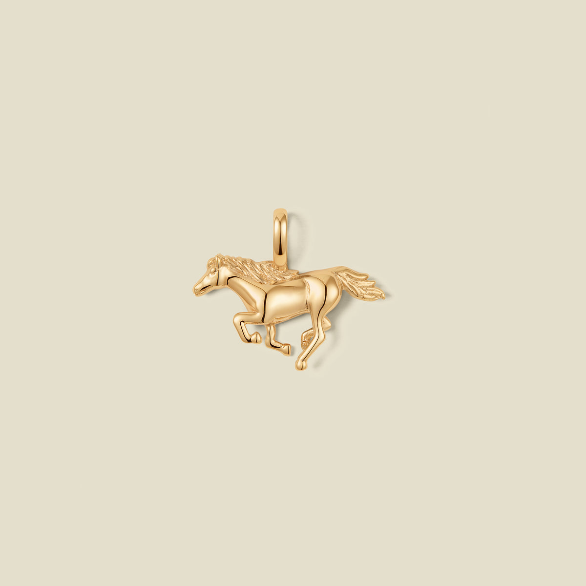 A gold running horse pendant charm.