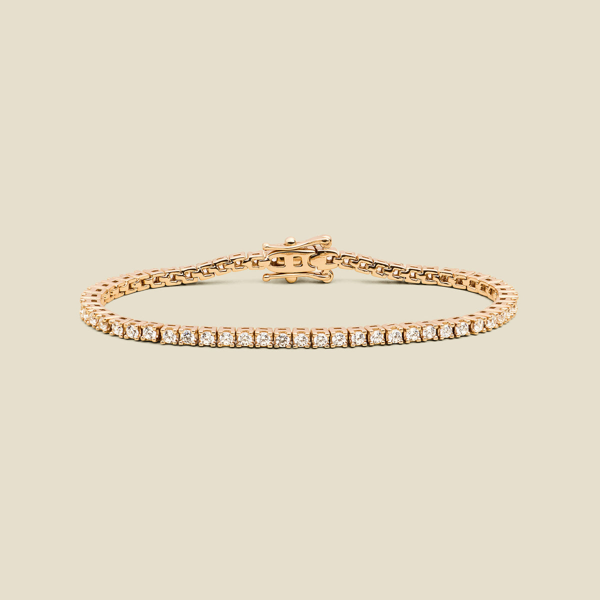 A gold tennis bracelet with clear square-cut gemstones, displayed on a solid light beige background.