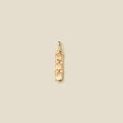 A gold pendant shaped like a snowboard with details, centered on a light beige background.