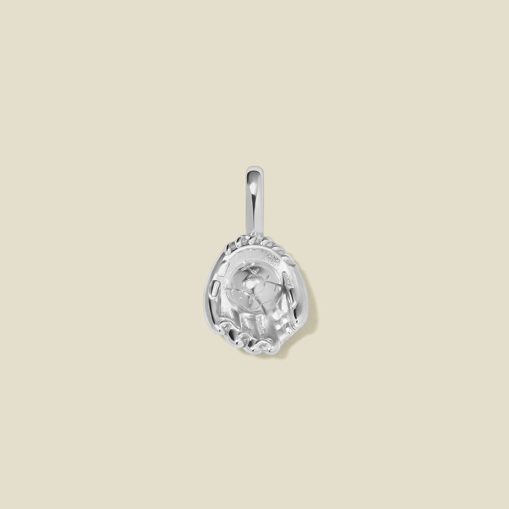 A silver baseball mitt charm with seam details, set against a solid beige background.