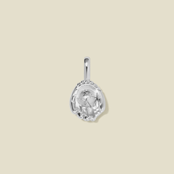 A silver baseball mitt charm with seam details, set against a solid beige background.