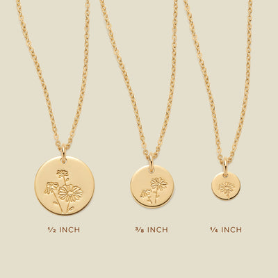 Three gold pendant necklaces, each with a different size of round flat disc and engraved with varying daisy flower designs. Below the necklaces there is the text '1/2 INCH', '3/8 INCH', and '1/4 INCH'.