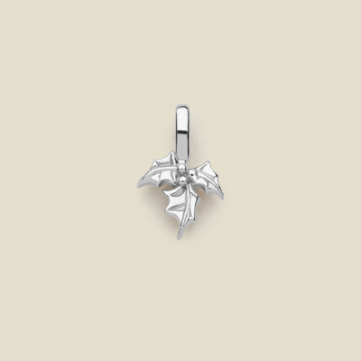 A silver charm in the shape of a holly leaf design, with a loop for attachment at the top.