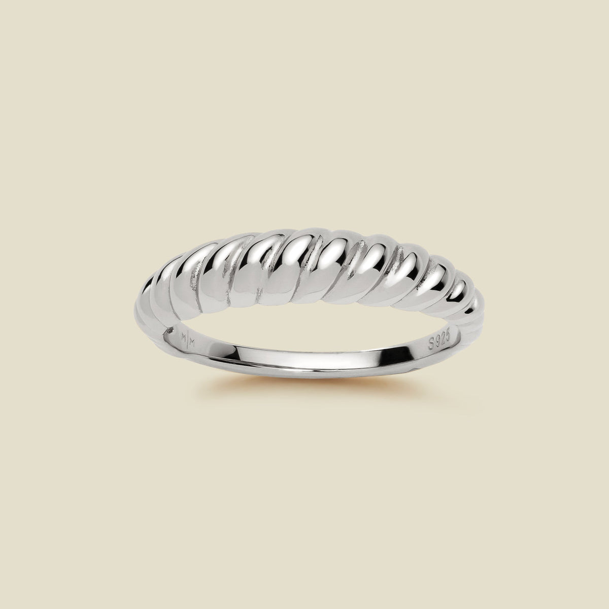 A thick silver twisted rope ring with a polished finish, displayed on a solid light beige background.