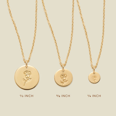 Three gold pendant necklaces, each with a different size of round flat disc and engraved with varying rose flower designs. Below the necklaces there is the text '1/2 INCH', '3/8 INCH', and '1/4 INCH'.